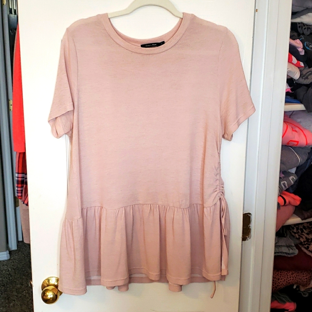 Cute soft pink shirt with ruffle bottom